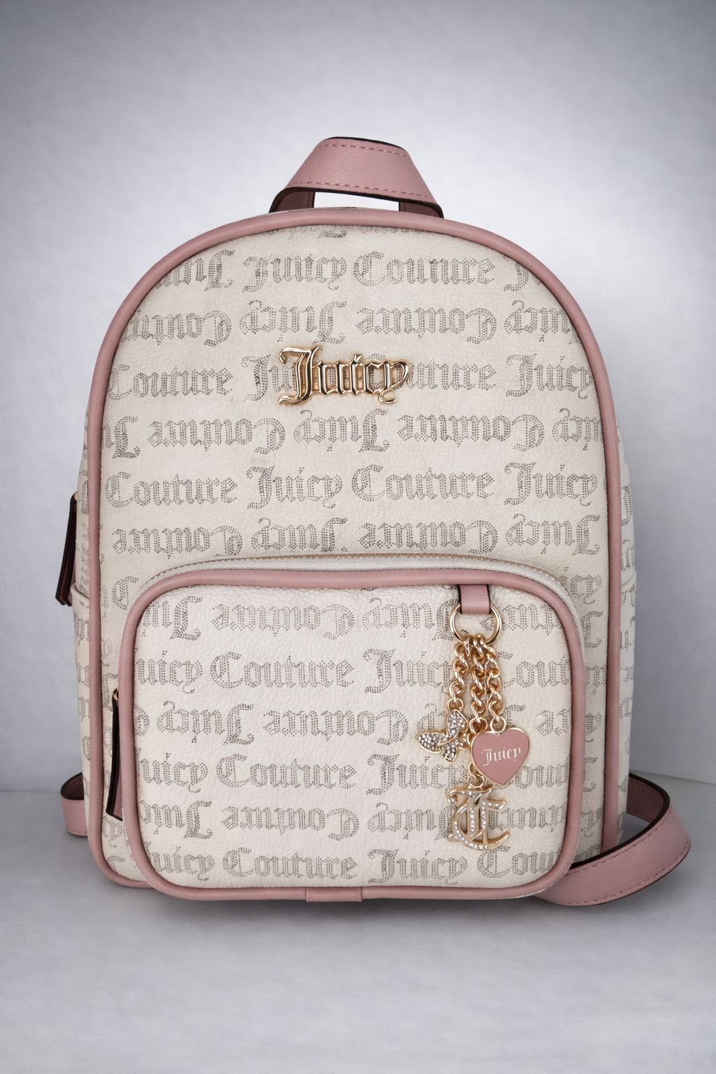 WhatsApp Image 2026-02-24 at 15.36.22 Mochila Mujer Juicy Couture – Color Beige con detalles Rosa - Imagen 1